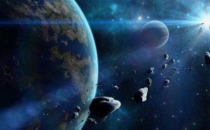 Планета и летящие астероиды  - скачать обои на рабочий стол