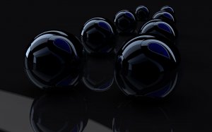 Стеклянные шарики на темном фоне - скачать обои на рабочий стол